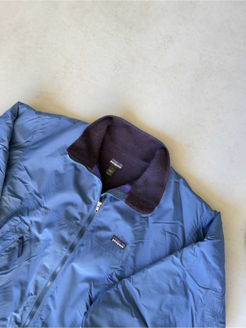 Patagonia Men’s Light Blue Puffer Jacket with Dark Purple Fleece Collar